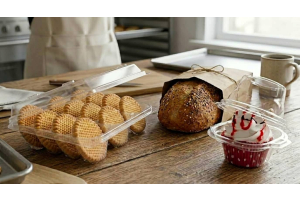 A curated kit of core bakery packaging types including PET clamshells, kraft bread bags, and cupcake dome containers for professional food service.